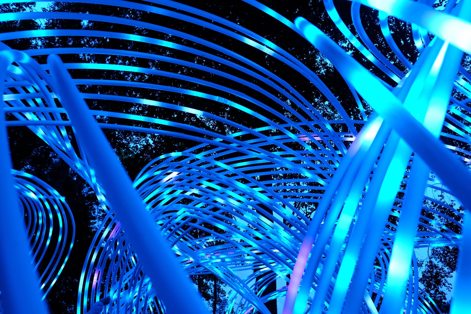 A close view of Kagora's crossing ribs reveals rows of blue and cyan LEDs running along the curved structure.